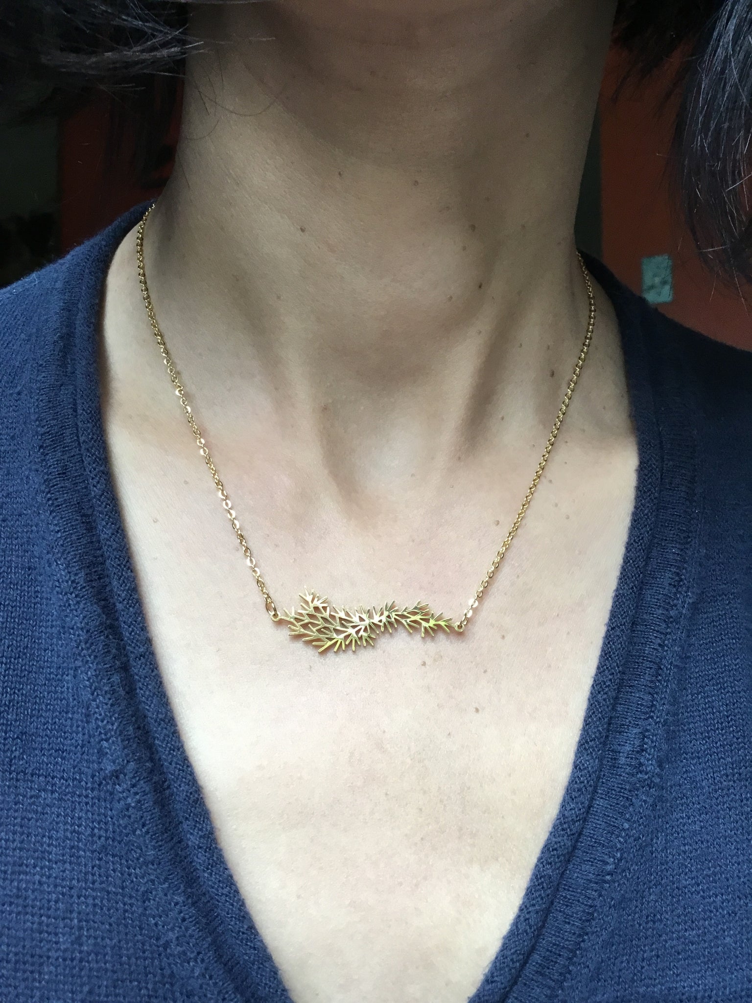 Evergreen branch pendant necklace